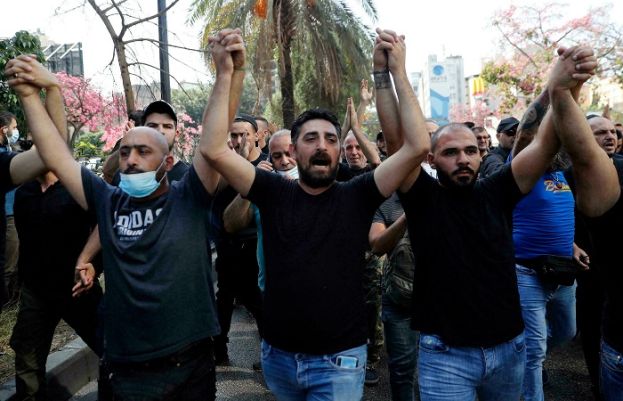 At least 6 killed, dozens wounded in gunfire near Beirut protest