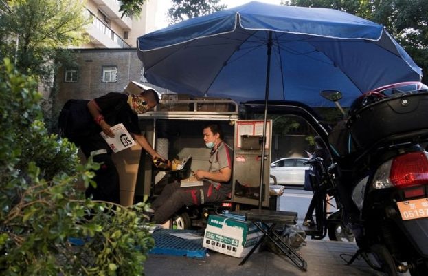 China urges caution opening overseas mail after Omicron case