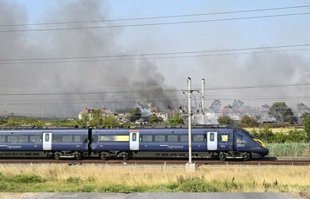 Fire engulfs homes near London as temperatures hit record 40C