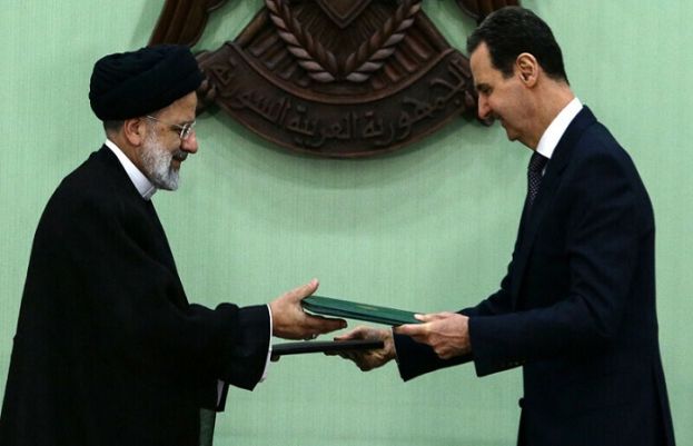 Iranian President Ebrahim Raeisi and his Syrian counterpart Bashar al-Assad