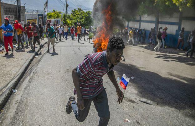 Violence flares again in Haiti as PM questions promised political solution